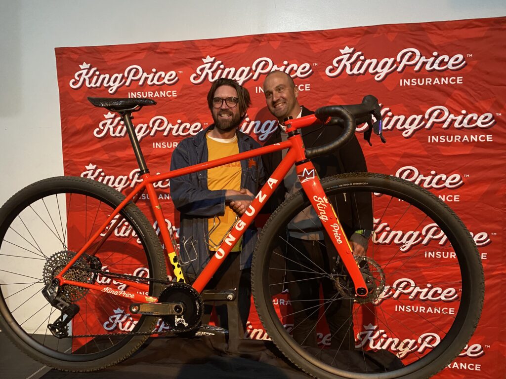 Dan Craven and King Price Insurance Namibia chief executive officer Braam Vermeulen with the 32-inch gravel bicycle. Contributed